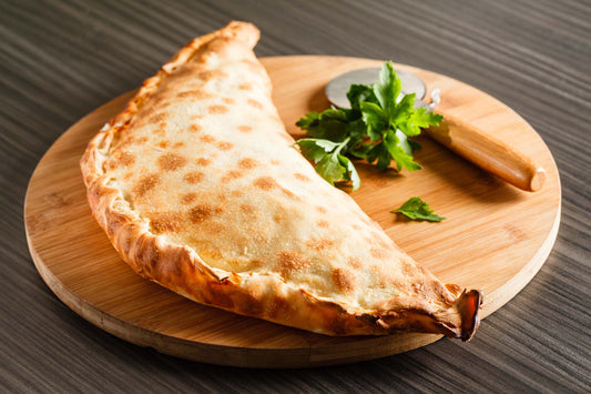 29. CALZONE 1 Tomat, ost, skinke.