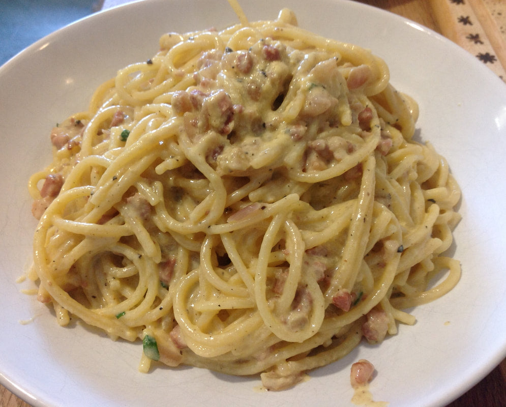 97. SPAGHETTI CARBONARA Med bacon, æg, flodesauce.